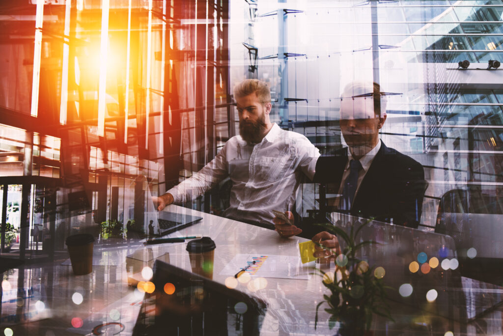 Double exposure of business people who work together in office